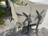 a bench that has a bunch of chairs on it