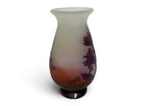 a glass vase with a purple and white design on it