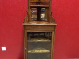 a small wooden cabinet with a mirror on top of it