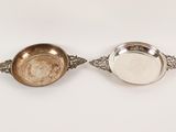 pair of silver plated bowls with handles and handles