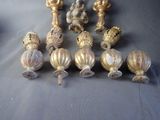 many different types of brass knobs on a table