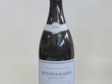a bottle of wine that is sitting on a table