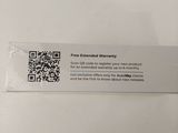 a person holding up a qr code on a table