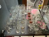 a table with a lot of empty glasses on it