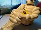 a statue of a man with a sash sitting on a table