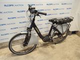 a bicycle that is parked in front of a wall