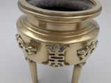 an image of a brass incense burner on a white background