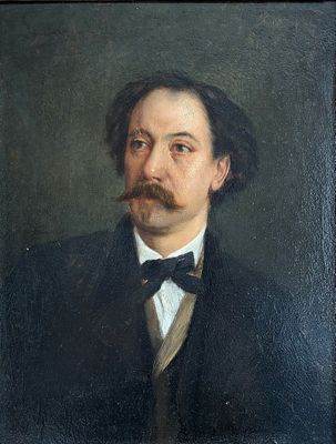 portrait of a man with a mustache in a suit and bow tie