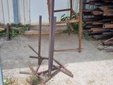 a pile of wood sitting next to a pile of metal