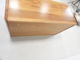 a wooden table with a laptop on top of it