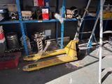 a pallet that is sitting on the ground in a garage