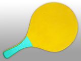 a yellow ping pong paddle with a blue handle on a gray background