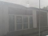 a reflection of a house in the window of a van