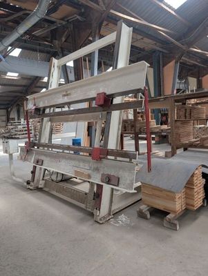 several pieces of wood are stacked on top of a pallet in a warehouse