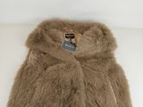a close up of a fur coat on a white surface