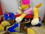 two stuffed animals that are sitting next to each other