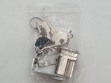 two keys that are in a bag on the table