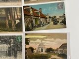 many old postcards of people and horses on the street