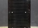 an image of a black and blue cooler sitting on top of a cement floor
