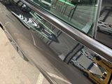a reflection of a bike in the window of a car