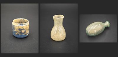 several different types of vases are displayed on a black surface