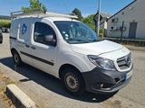 a white van that is parked on the side of the road