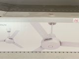 a box with a white ceiling fan inside of it