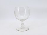 a glass that is sitting on a white surface