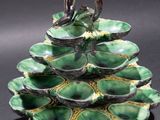 a close up of a plate with a bird on top of it
