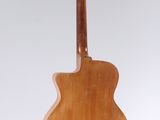 a wooden guitar hanging from a string on a white background