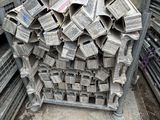 a large pile of newspapers sitting on a pallet