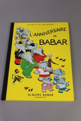 a yellow book with an image of a group of cartoon characters on it