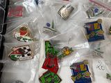 a lot of pins in a plastic bag on top of a table