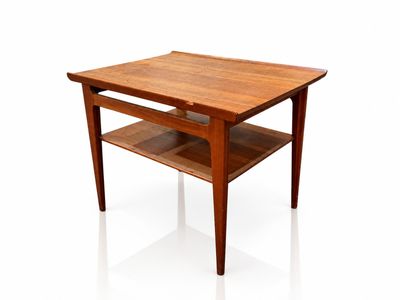 a wooden table with a shelf underneath it