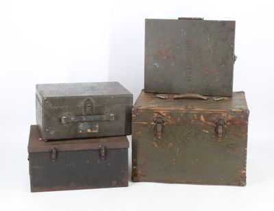 three trunks stacked on top of each other on a white surface