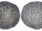 une pièce d'argent avec une couronne au recto et une couronne au verso