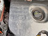 a close up of a car ' s engine with the hood open