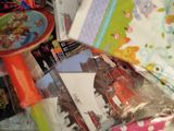 a pile of children ' s toys and books on a table