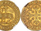 a gold coin with an image of a sheep on it