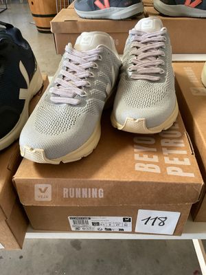 several pairs of running shoes are on display in a shoe store