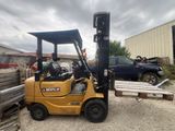 a forklift that is parked in a lot