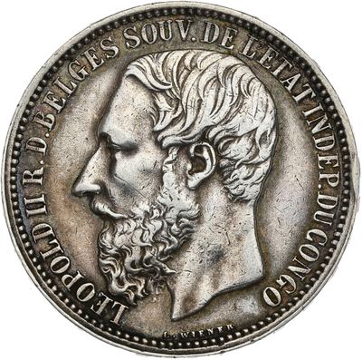a close up of a coin with a man ' s face on it