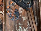 a wooden box with a pair of shoes and a pair of shoes on it