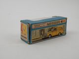 a toy bus that is sitting on a white surface