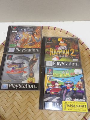 three video games are sitting on top of a basket on a table