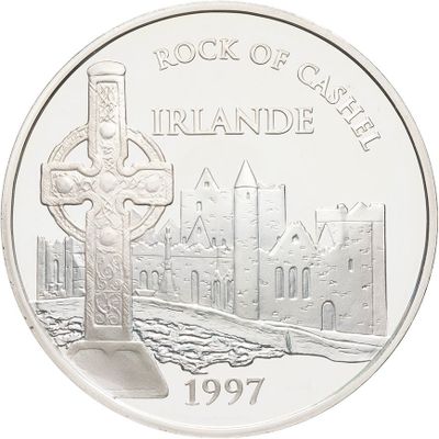an image of a silver coin with a cross on it