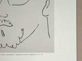 drawing of a man with glasses and a beard on a piece of paper