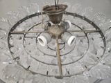 an image of a glass chandelier hanging from a ceiling