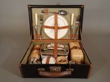 a suitcase that has a set of silverware in it