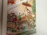 a picture of a book with a picture of a man riding an elephant